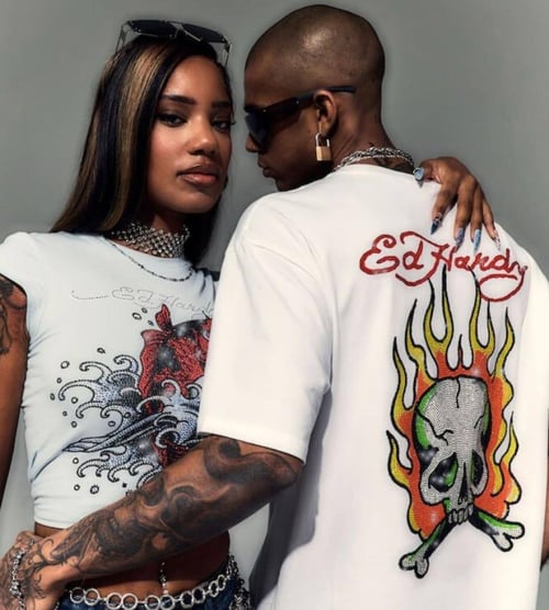 Two models posing wearing Ed Hardy clothing